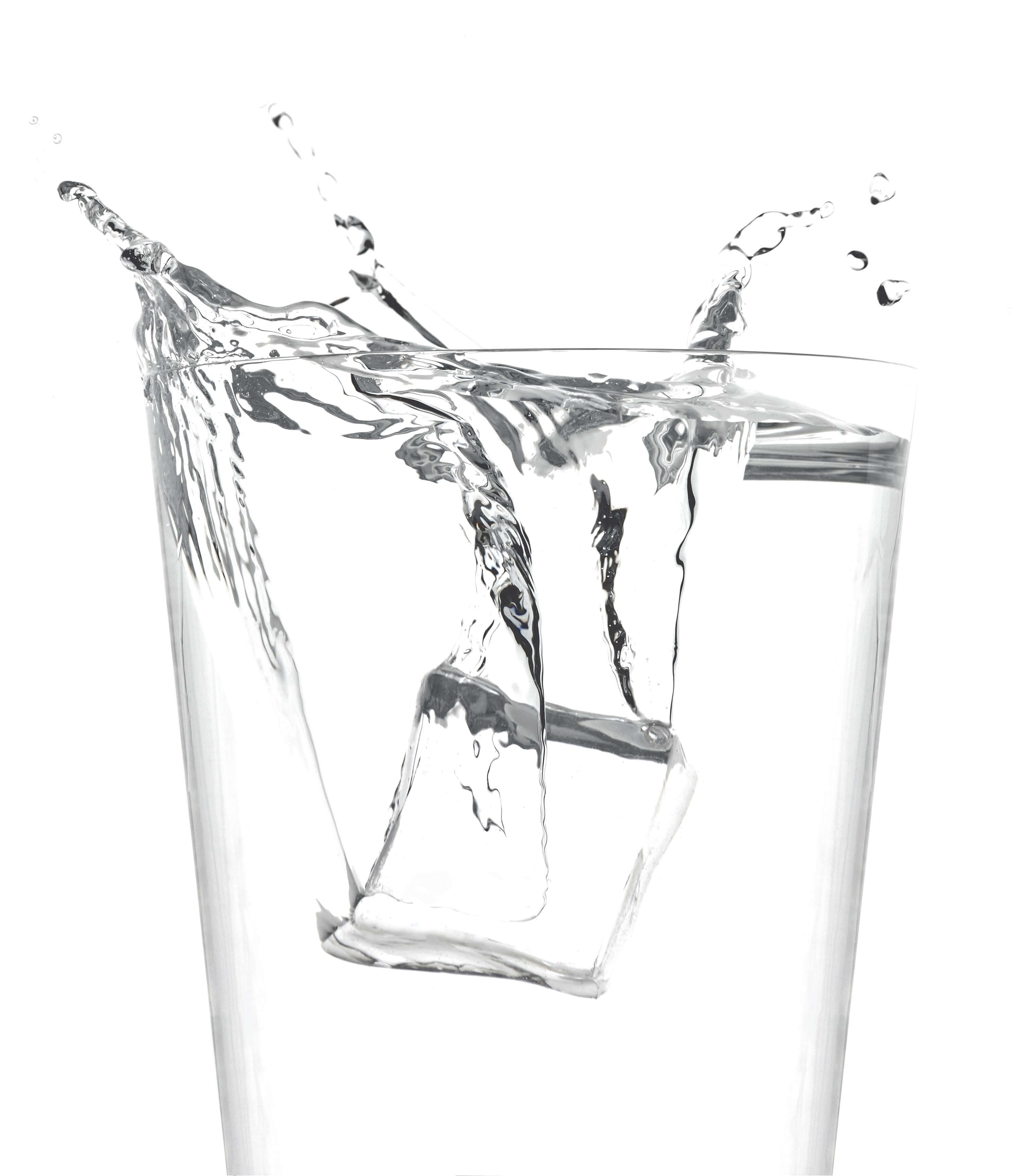 Ice cube dropping into water glass